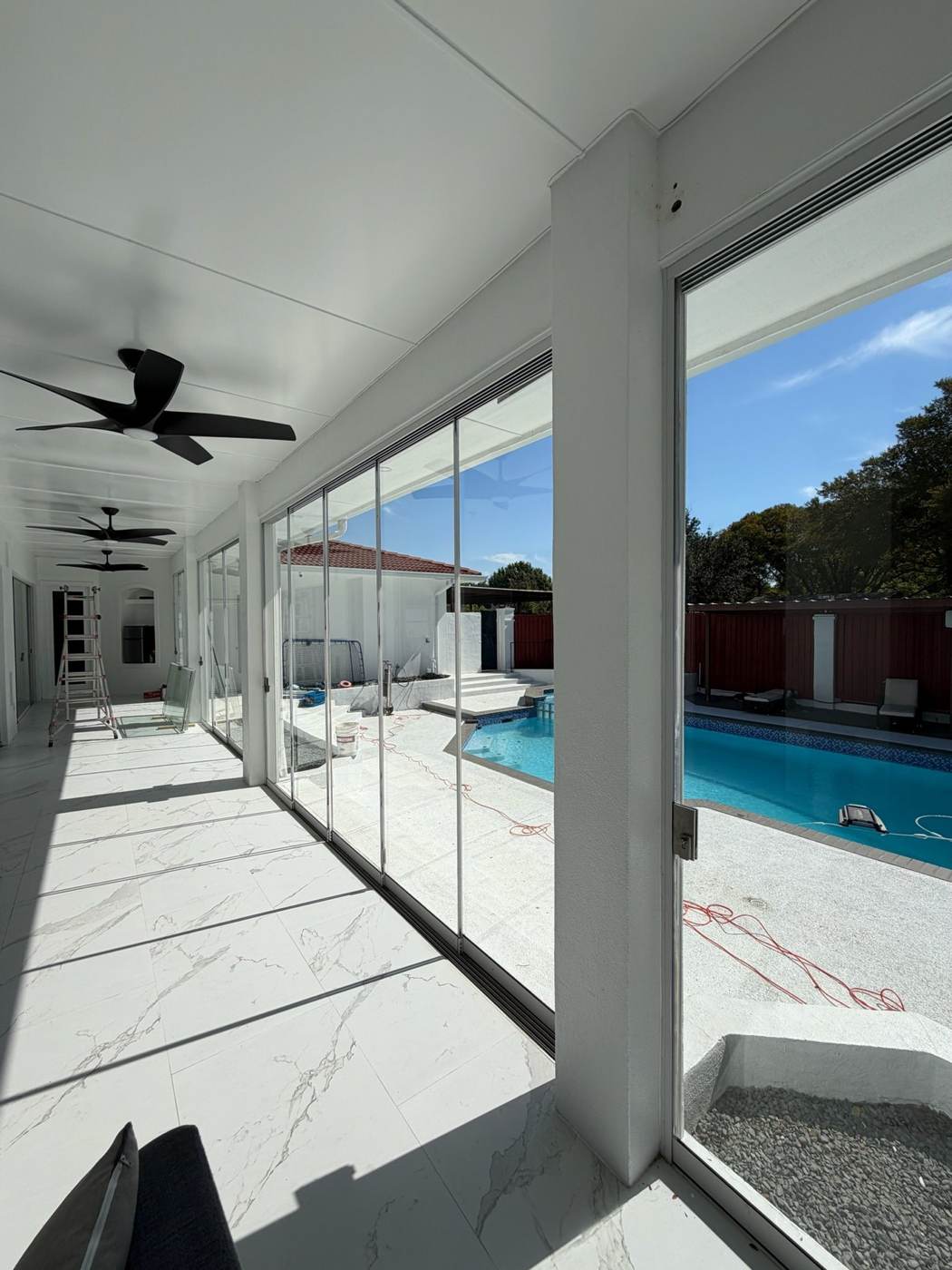 Folding glass wall cleaned by Blu's